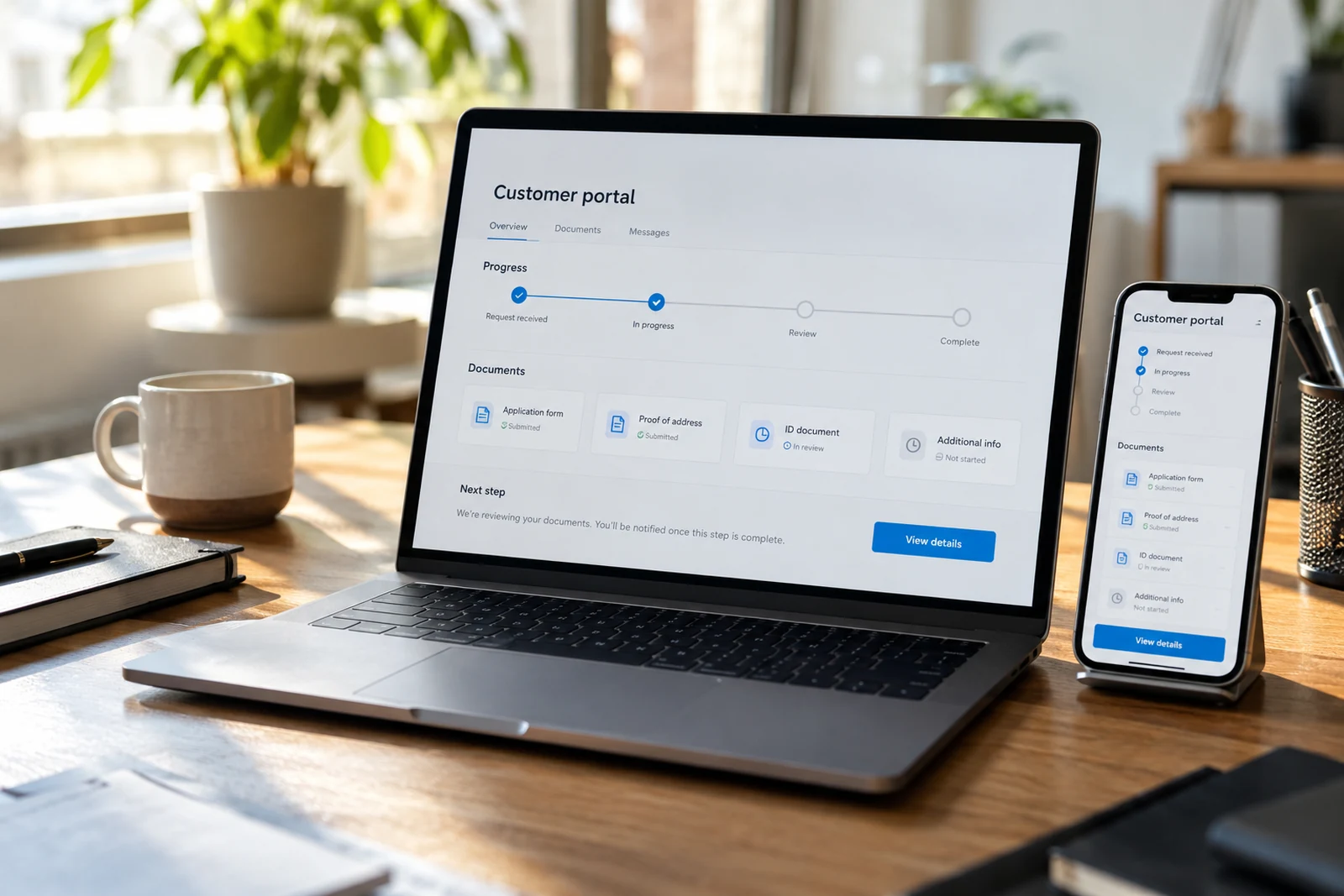 A customer portal displayed across laptop and phone
